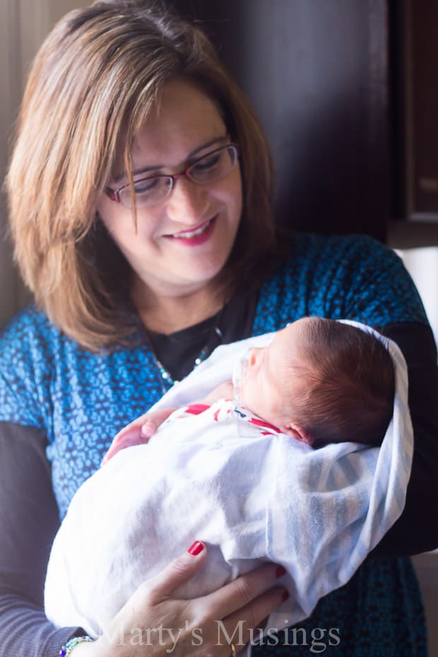 A woman holding a baby