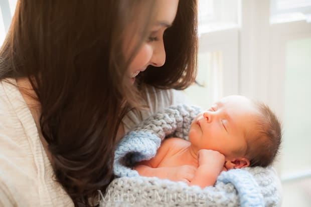 A woman holding a baby