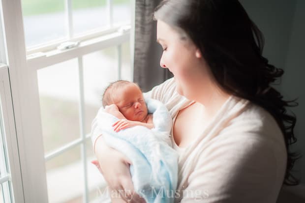 A woman holding a baby