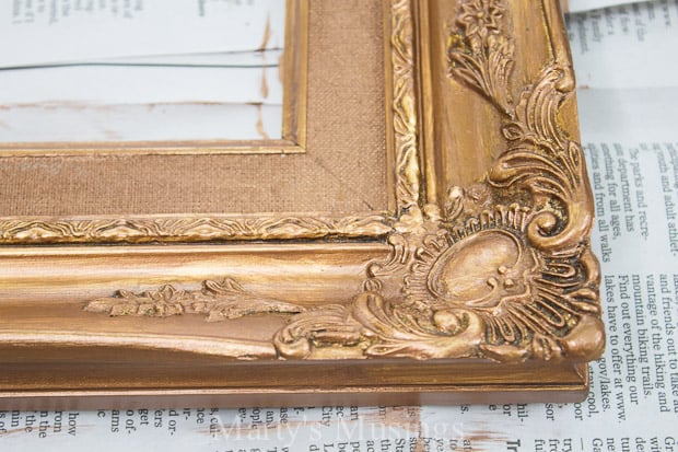 Closeup of painted vintage gold frame details