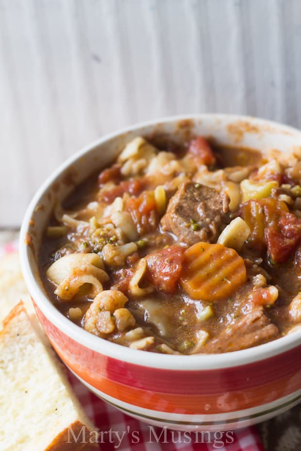 A bowl of food on a plate, with Soup and Recipes