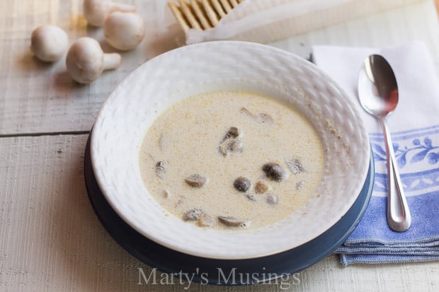 A bowl of food on a table, with Cooker and Soup