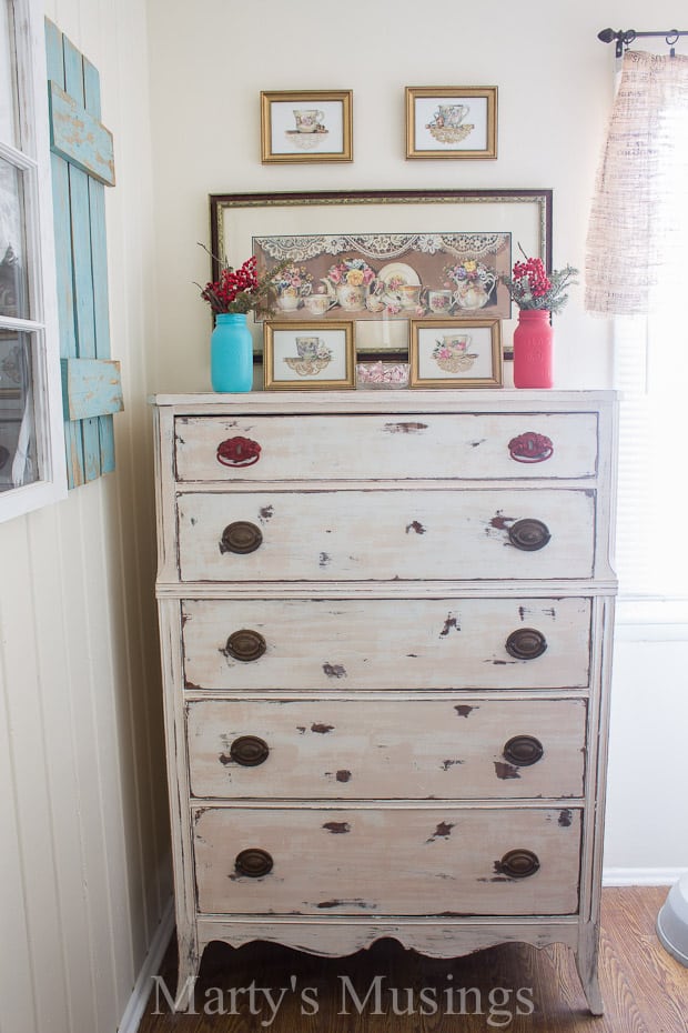 This ugly piece of furniture was found on a curb before it was transformed into a gorgeous chalk painted dresser with paint and a little bit of work!