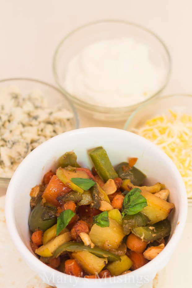 A bowl filled with different types of food on a plate