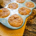 A bowl of food on a table, with Peach and Cobbler