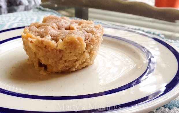 A piece of cake on a plate, with Muffin and Peach