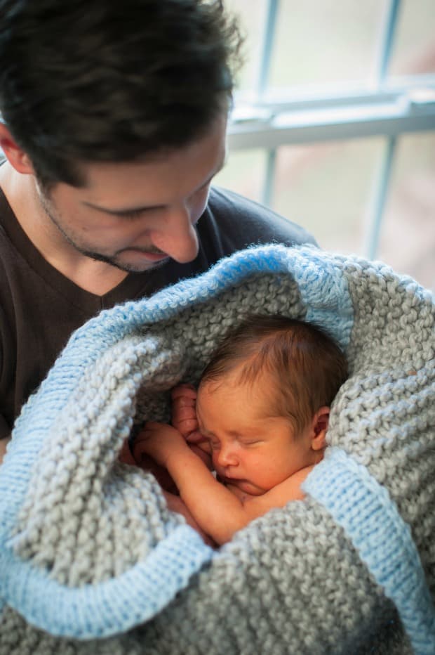 A person holding a baby