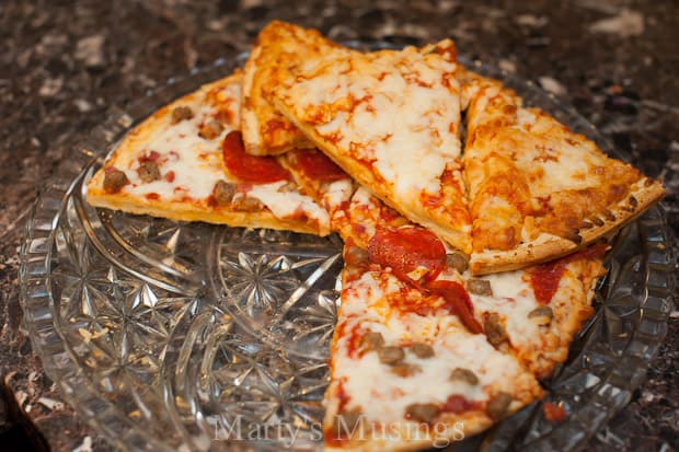 A slice of pizza on a grill