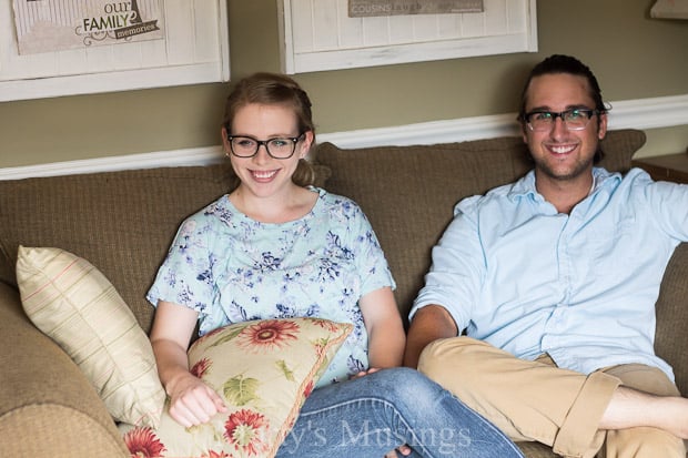 A man and a woman sitting on a couch