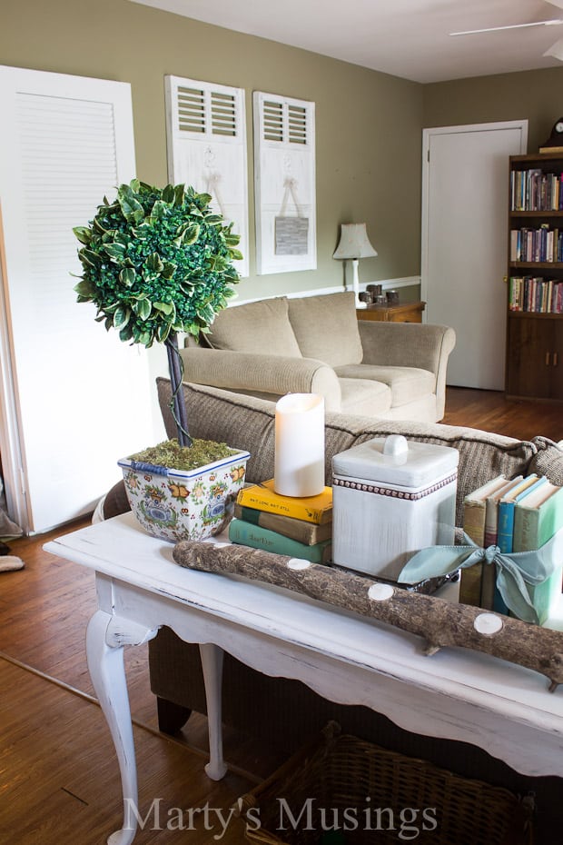 A living room filled with furniture and a fireplace