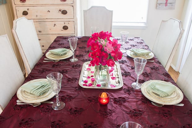 A pink flower on a table