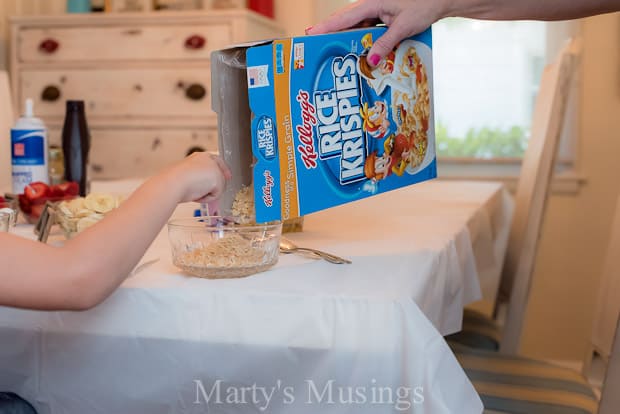 A person sitting on a kitchen counter