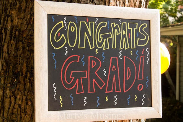 A blackboard sign on a pole