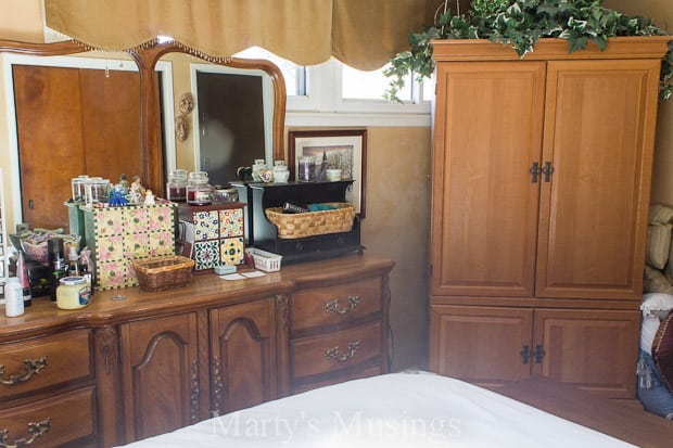 A kitchen with wooden cabinets