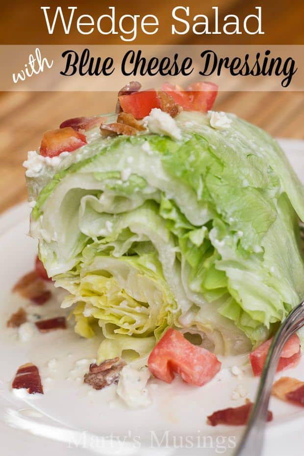 A close up of a plate of food, with Salad and Blue cheese dressing