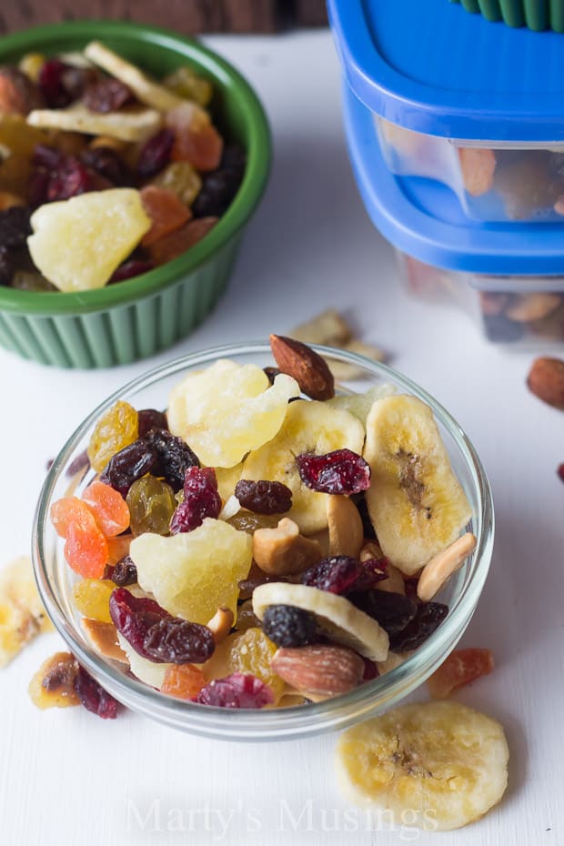 A plastic container filled with different types of food on a plate