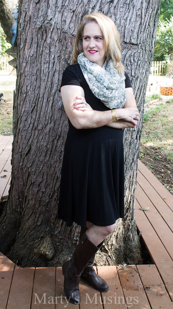A woman standing next to a tree