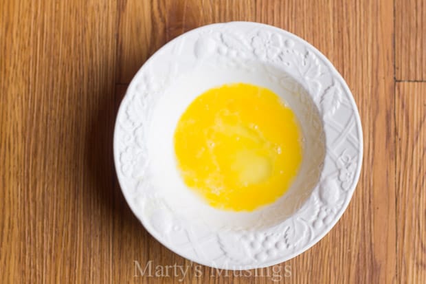 An egg on top of a wooden table