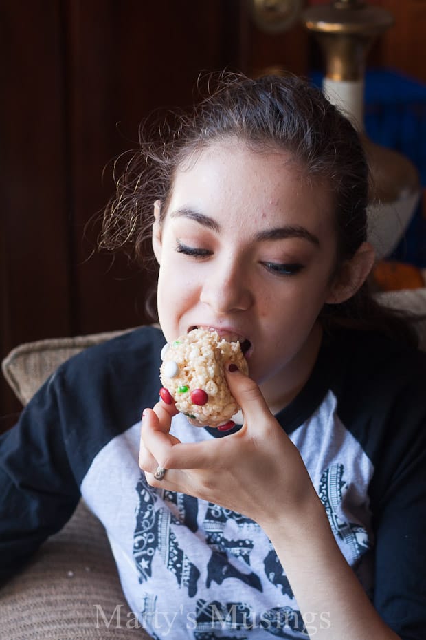 A person that is eating some food, with Rice Krispies