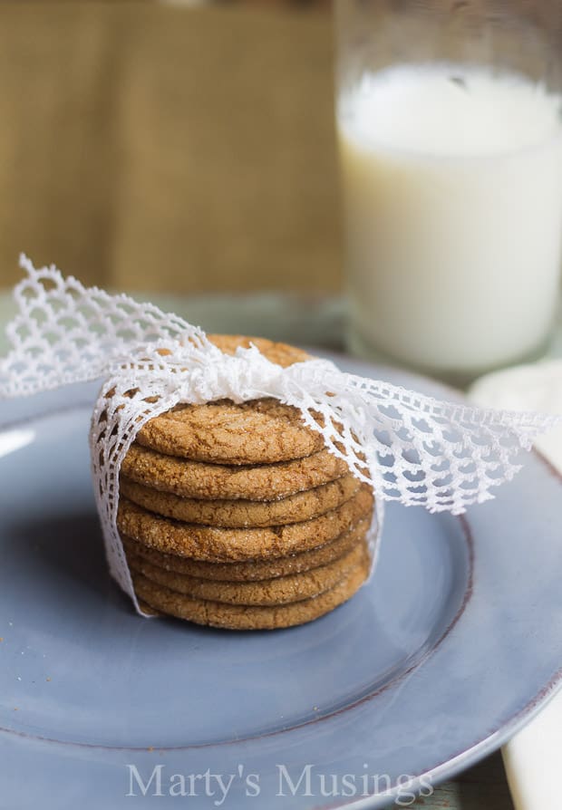 Molasses cookies on blue plate wrapped with white lace