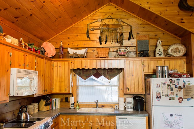 A kitchen filled with appliances and wooden cabinets