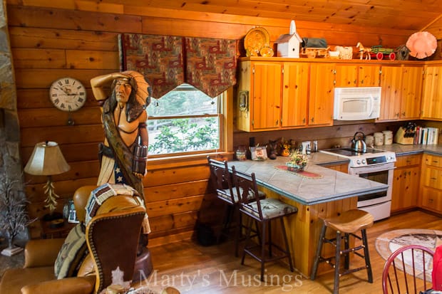 A kitchen with a table in a room