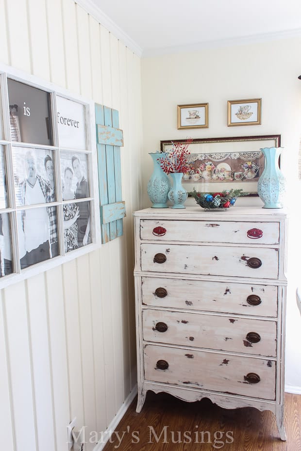 A room filled with furniture and a refrigerator