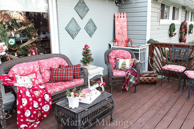 Front deck decorated for Christmas with red accents