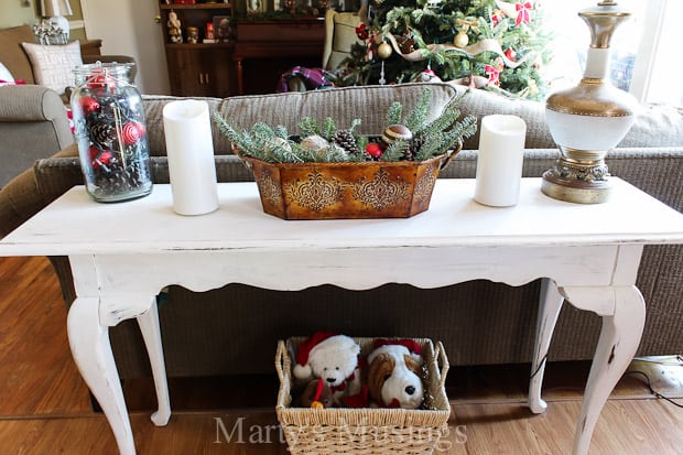 A cat sitting on top of a wooden table