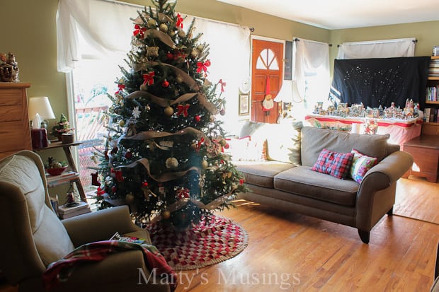 A living room filled with furniture and a christmas tree