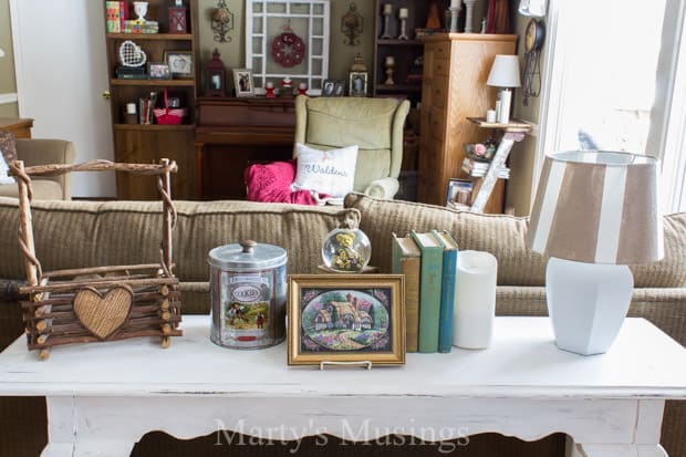 A room filled with furniture and vase on a table