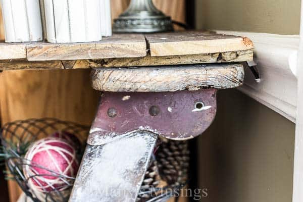 A trash to treasure Step Ladder Shelf makes the perfect side table in this shabby chic home filled with rustic repurposed treasures and budget DIY projects.