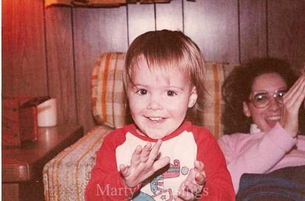 A little boy sitting at a table