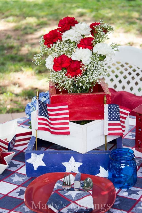 A cake sitting on top of a picnic table