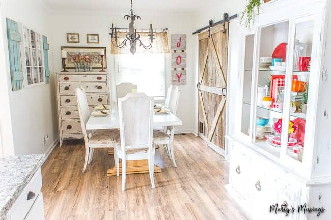 A room filled with furniture and a refrigerator