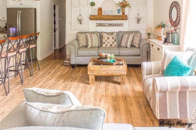 A living room filled with furniture and a fire place