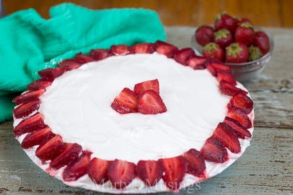 A cake on a plate, with Berry and Cream