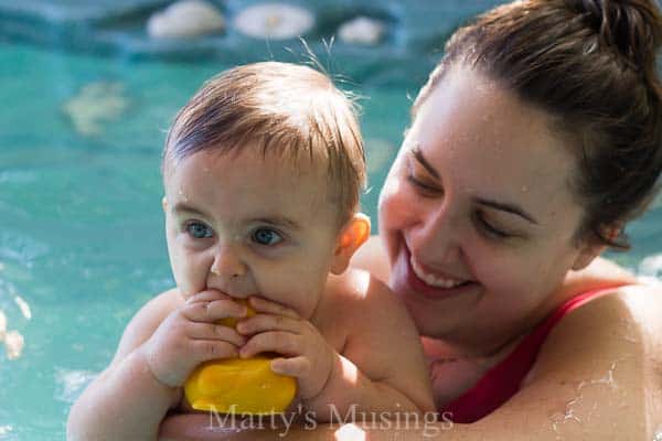 A little boy that is swimming in the water