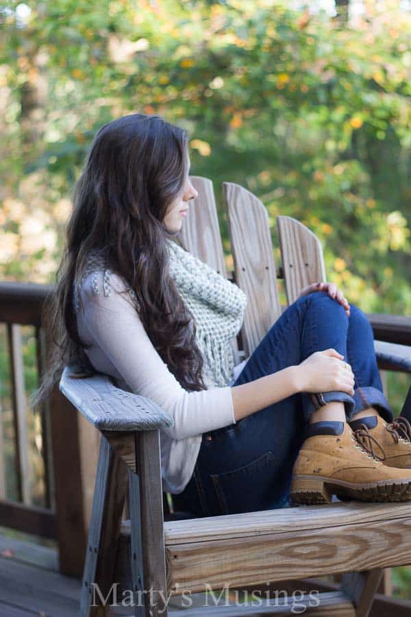 A woman sitting at a picnic table