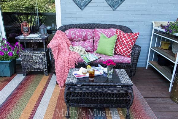 Colorful front deck with rustic furniture