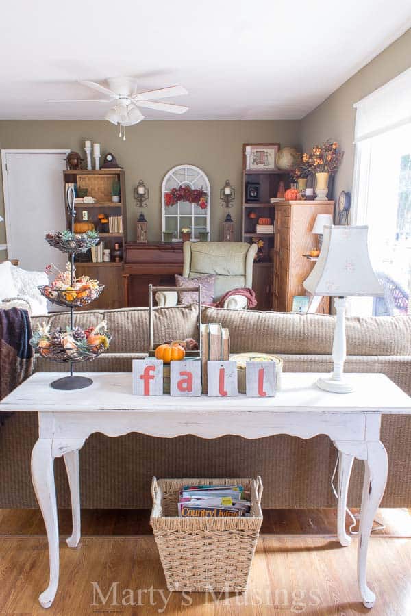 A living room filled with furniture and a fire place