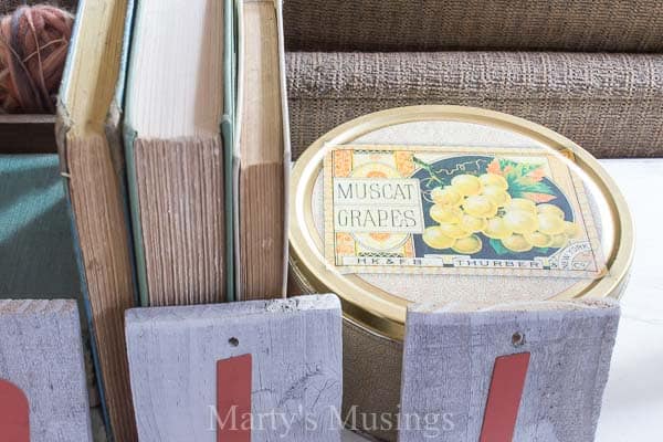 backward books and tin as part of fall vignette