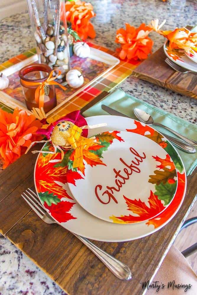 A table topped with plates of food on a plate, with Orange and Mod Podge