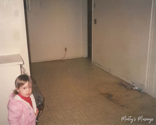 A little girl standing in a room