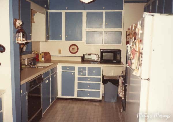 A kitchen with a sink and a microwave