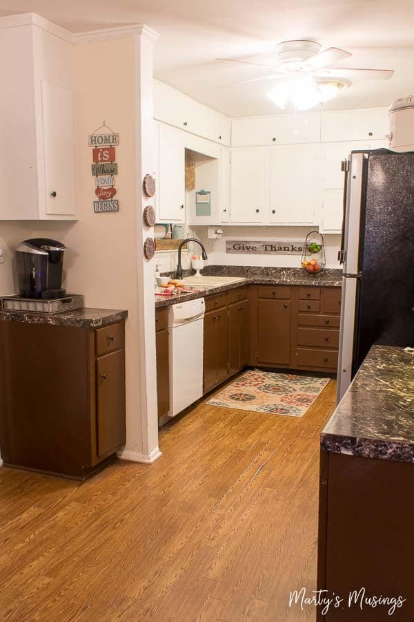 A kitchen with a stove and a refrigerator