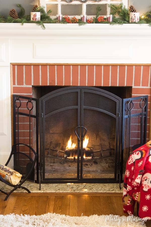 A stove top oven sitting next to a fireplace