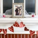 This cheap and fast DIY Valentines Day banner is made out of gift bags from the dollar store. Perfect for the mantel from dollar store items for under $15!