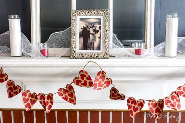 Mantel with heart banner and Valentine's Day decor