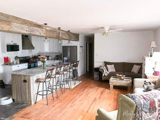 partially completed kitchen and living room remodel Remodeled kitchen without new flooring and unorganized